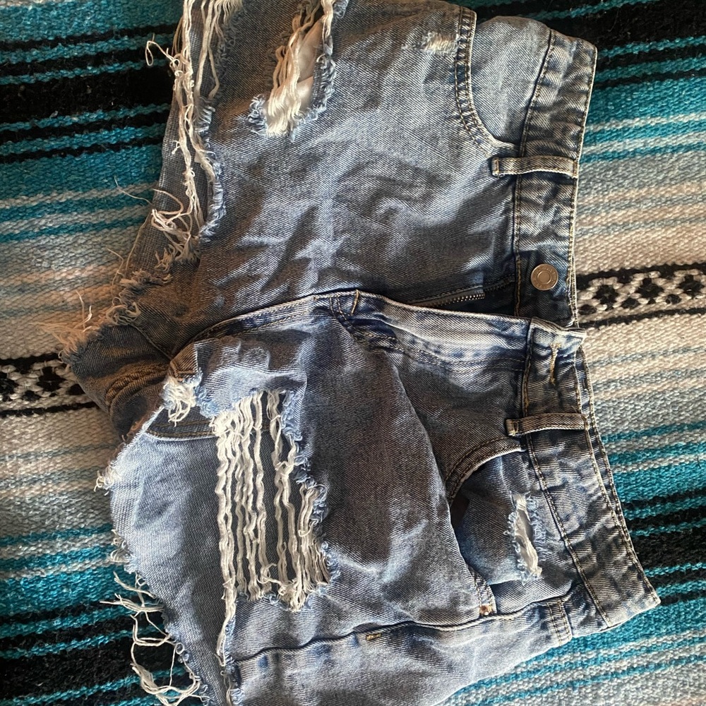 Ripped . Blue Jean Shorts .
